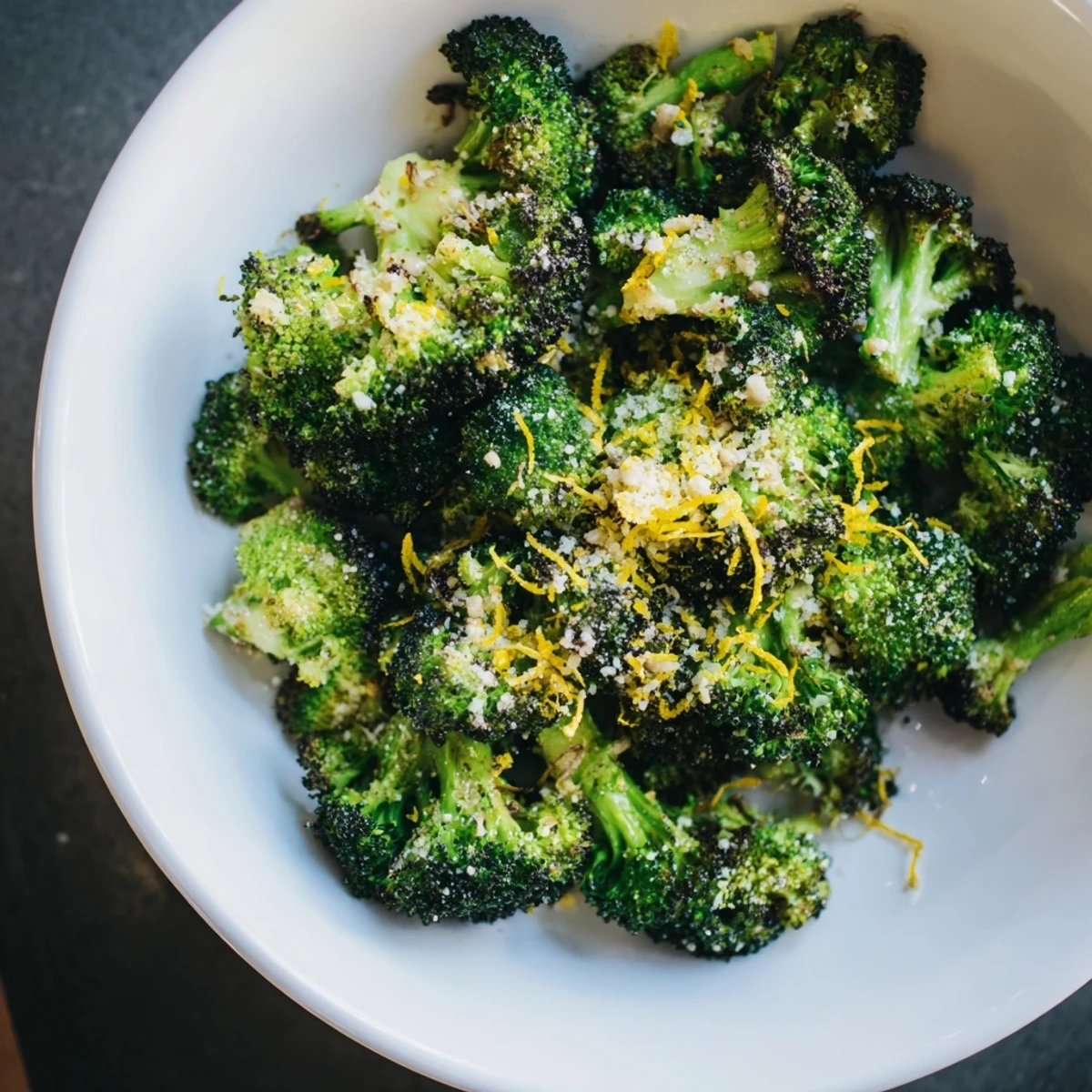 Close-up of fragrant Simple Garlic and Parmesan Roasted Broccoli, perfectly tender with a Parmesan crust.