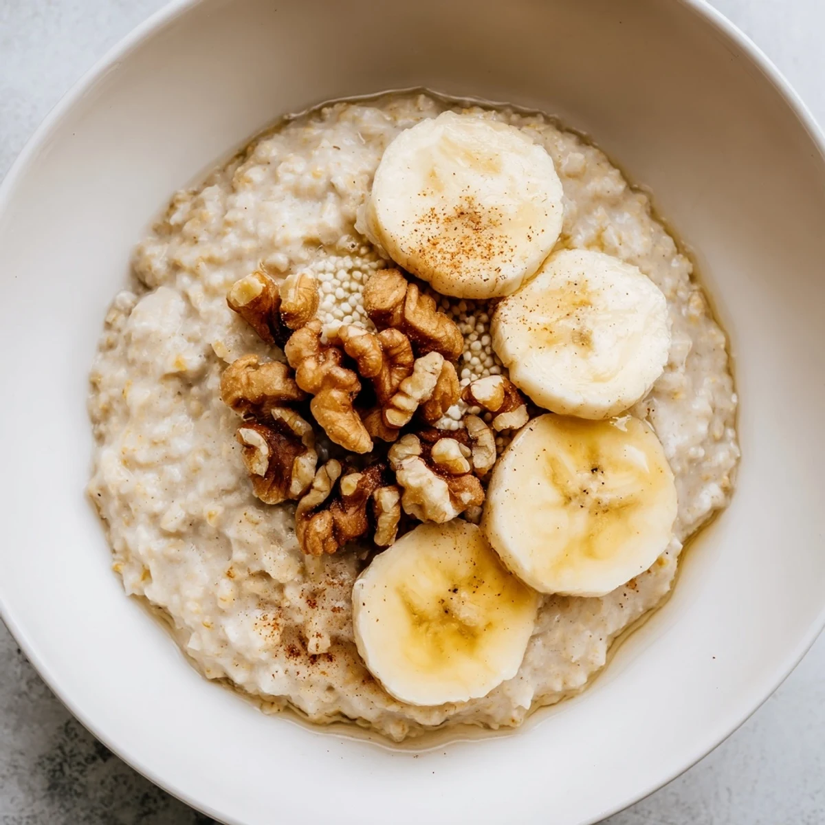 A close-up shot of creamy, steaming microwave banana oats, ready for a delicious breakfast.