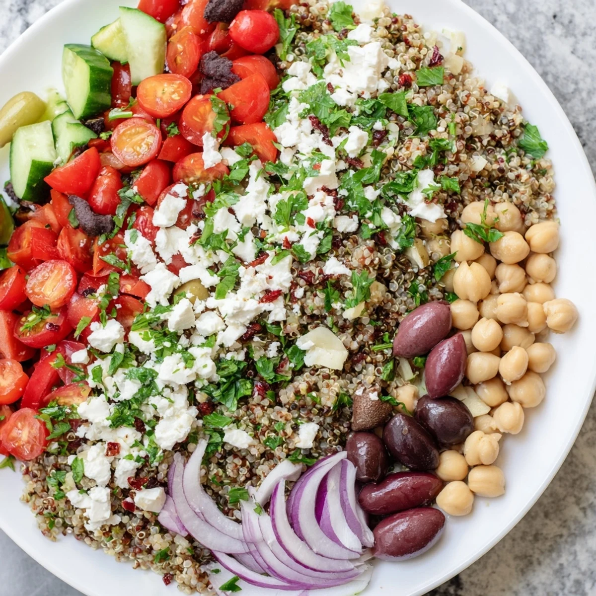 Healthy Greek Power Salad with quinoa, lentils, and chickpeas ready for a quick dinner.