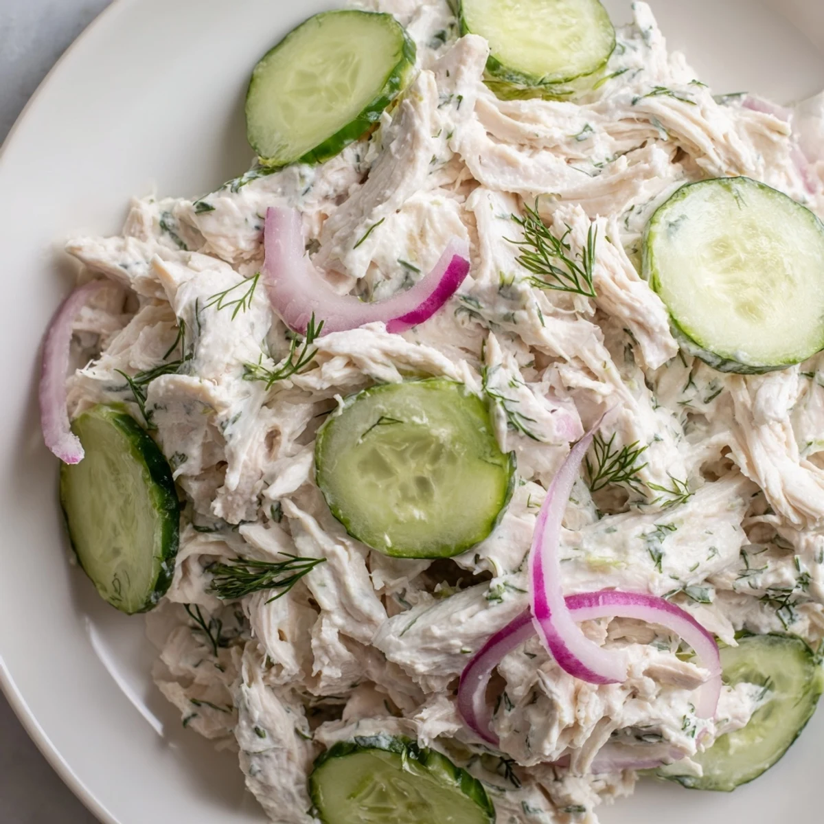Close-up of Creamy Cucumber Chicken Salad showcasing juicy chicken and crunchy cucumbers, ideal for a light high-protein lunch.