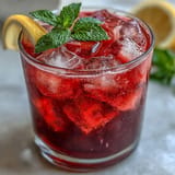 Vibrant pink lemonade from beets, perfect for a refreshing summer drink.