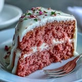 Elegant Rosé Velvet Cake for a bridal shower, frosted and dripping gold.