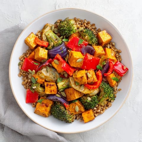 A flavorful Hearty Roasted Vegetable and Farro Grain Bowl, the perfect vegetarian lunch with a bright lemon dressing.